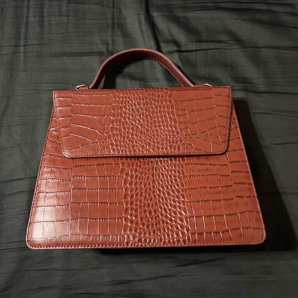 Nordstrom brown leather top-embossed top handle bag with crossbody strap.